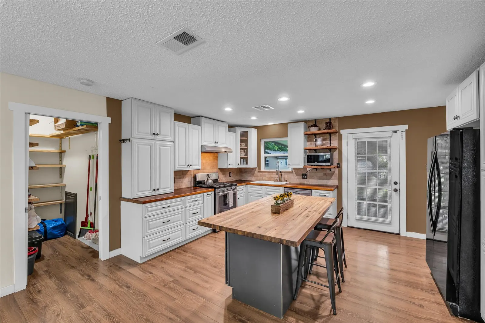 Eye-level view of the cozy kitchen with vintage fixtures