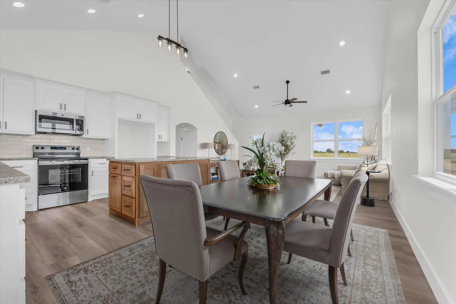 High angle view of a spacious kitchen with granite countertops and custom cabinetry