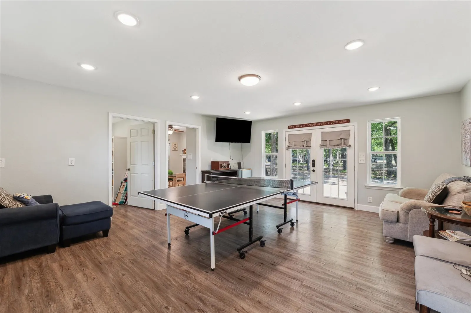 Eye-level view of the kitchen showcasing updated appliances and cozy ambiance