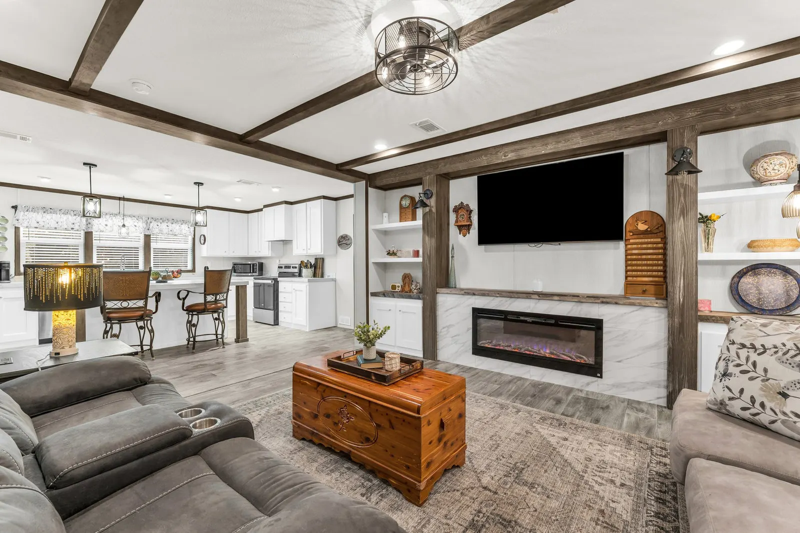 Eye-level view of a bright kitchen with a large island and warm wood accents.